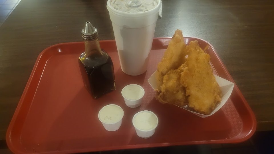Printed menu with fish, shrimp, and chicken combos.