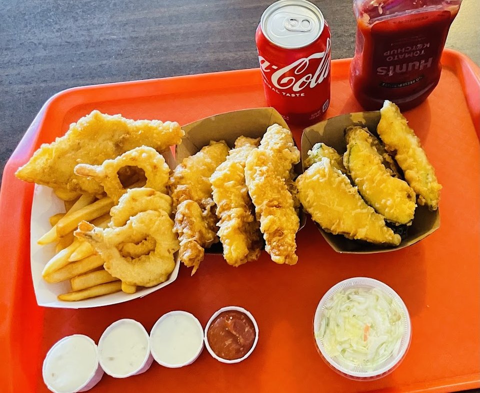 Printed menu with fish, shrimp, and chicken combos.