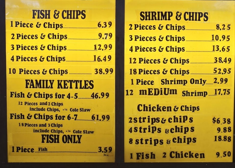Fast-food menu featuring fried seafood and chip plates.